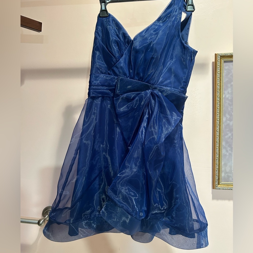 silky short beautiful dress with bow on the front. one strap. fits perfect
